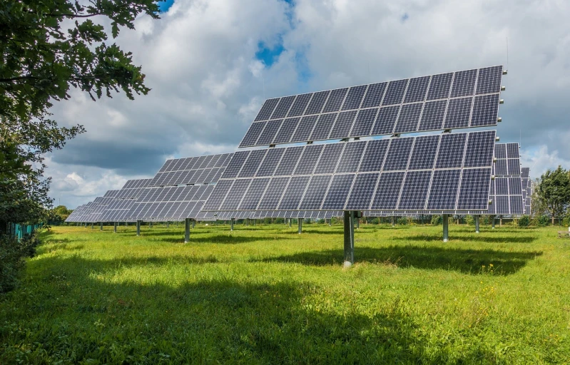 a large array of solar panels in a field, a stock photo, by Xul Solar, bauhaus, 🤬 🤮 💕 🎀, green spaces, il