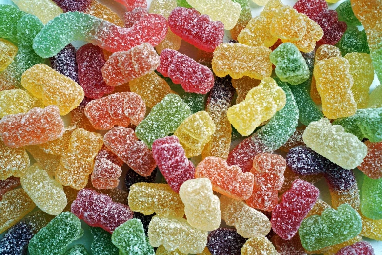 a pile of gummy bears sitting on top of a table, a stock photo, shutterstock, hurufiyya, jelly - like texture, jackstraws, close-up product photo, crisp details