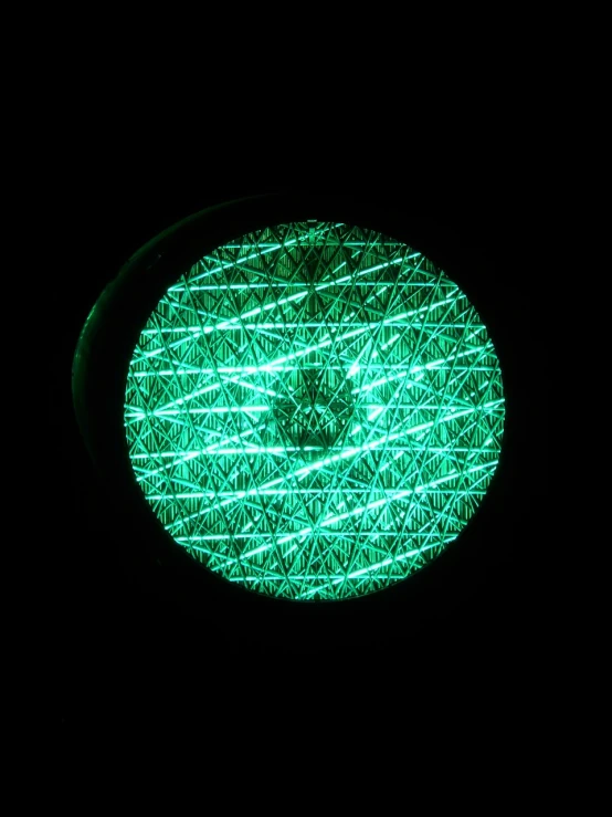 a close up of a traffic light in the dark, inspired by Bruce Munro, flickr, green steampunk lasers, top down extraterrestial view, stippled light, fiberoptic hair