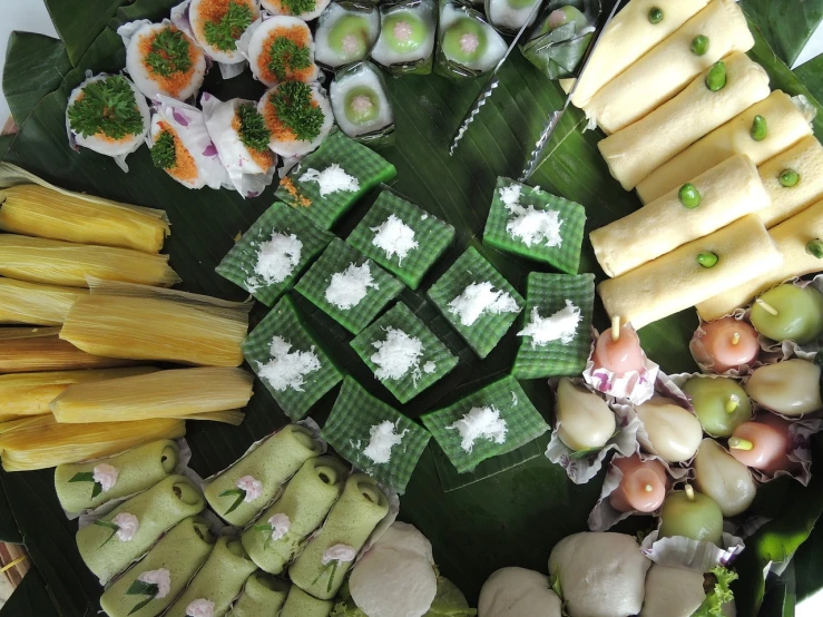 a close up of a plate of food on a table, inspired by Lam Qua, hurufiyya, made out of sweets, photograph credit: ap, thai, green