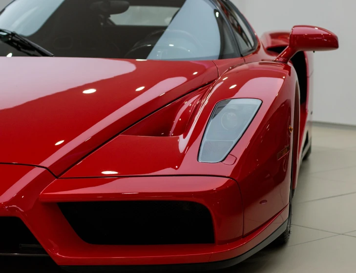 a red sports car parked in a showroom, inspired by Bernardo Cavallino, pexels contest winner, ferrari f 4 0, ultra clear detail, veneno, f50