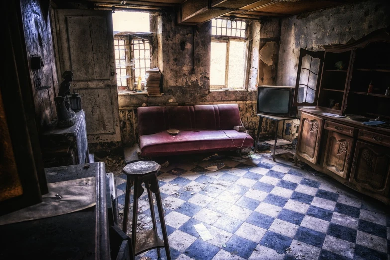 a living room with a red couch and a black and white checkered floor, inspired by Pieter de Hooch, pexels, inside a decayed operating room, abandoned house, hdr photograph, tiny room with dirty wall tiles