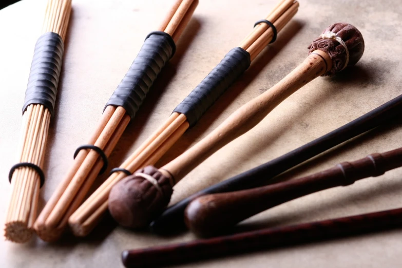 a bunch of chopsticks sitting on top of a table, a portrait, flickr, renaissance, new musical instruments, holding a wooden staff, knobs, wallpaper - 1 0 2 4