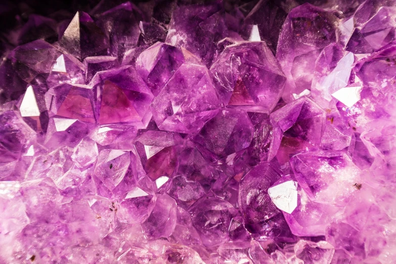 a pile of purple crystals sitting on top of a table, pexels, rich vibrant detailed textures, hd —h 1024, powerful radiant confident vibe, treasure background