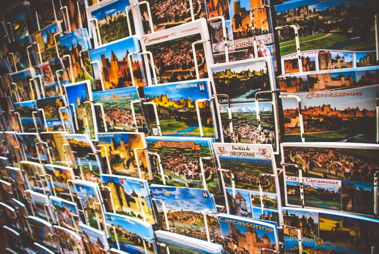 a bunch of pictures hanging on a wall, pexels, postcard, teruel city in 1989, gif, stacked