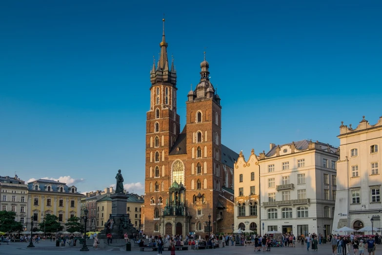 a group of people that are standing in front of a building, by Paweł Kluza, shutterstock, baroque, three towers, holy place, high res photo, very busy place