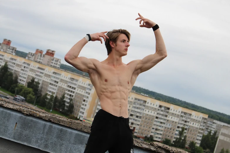 a shirtless young man standing on top of a skateboard, by Aleksander Kotsis, tumblr, realism, ifbb fitness body, mirror's edge in russia, photo taken in 2018, delicate androgynous prince