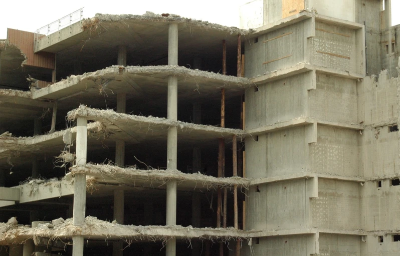 a picture of a building that is under construction, by Shigeru Aoki, flickr, brutalism, cracks, bangalore, debris, 3/4 side view