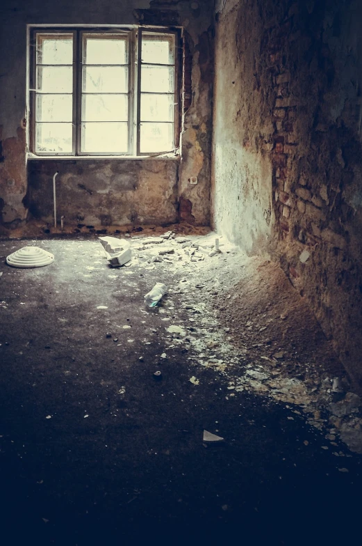 a dirty room with a broken window and debris all over the floor, a photo, very old photo, very detailed photo, broken bottles, bright daylight indoor photo