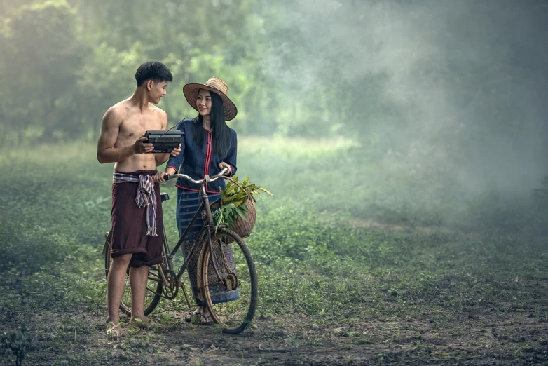 a couple of men standing next to a bike, a portrait, by John La Gatta, pexels contest winner, art photography, sukhothai costume, peasant boy and girl first kiss, working out in the field, calmly conversing 8k