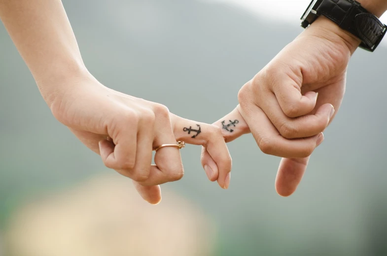 a close up of two people holding hands, a tattoo, romanticism, with anchor man and woman, 15081959 21121991 01012000 4k, gettyimages