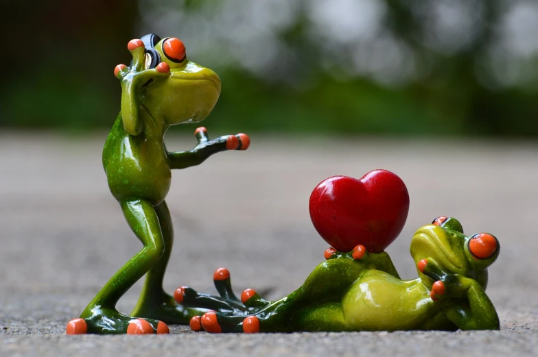 a figurine of a frog and a red heart, a picture, pexels, figuration libre, passionate pose, talking, falling in love, kermit