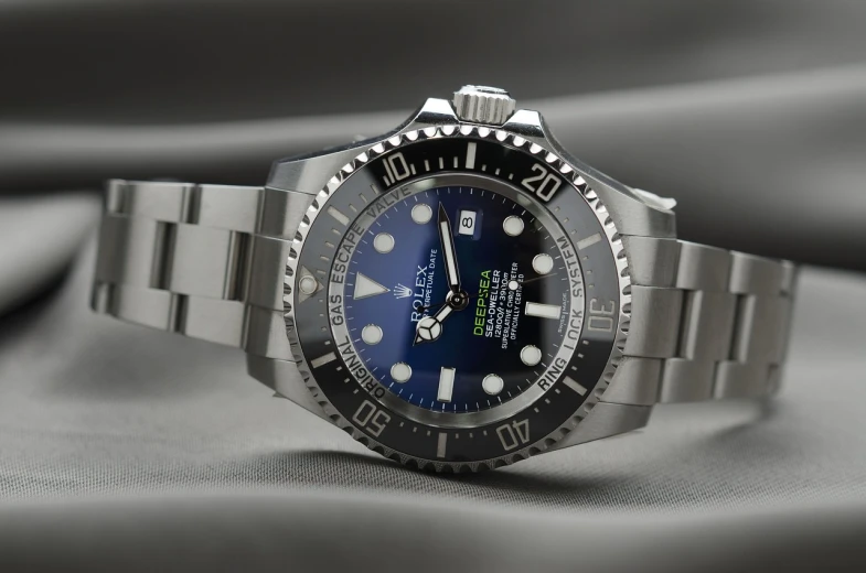 a close up of a watch on a table, rolex, deep blue sea color, productphoto, watch photo