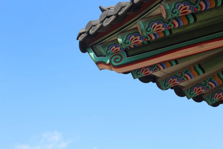 a clock that is on the side of a building, a picture, cloisonnism, korean traditional palace, crisp lines and color, bright summer day, underside