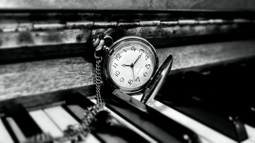 a pocket watch sitting on top of a piano keyboard, a black and white photo, trending on pixabay, fine art, 🕹️ 😎 🔫 🤖 🚬, a rustic album cover of a clock, close up portrait photo, nostalgic high saturation