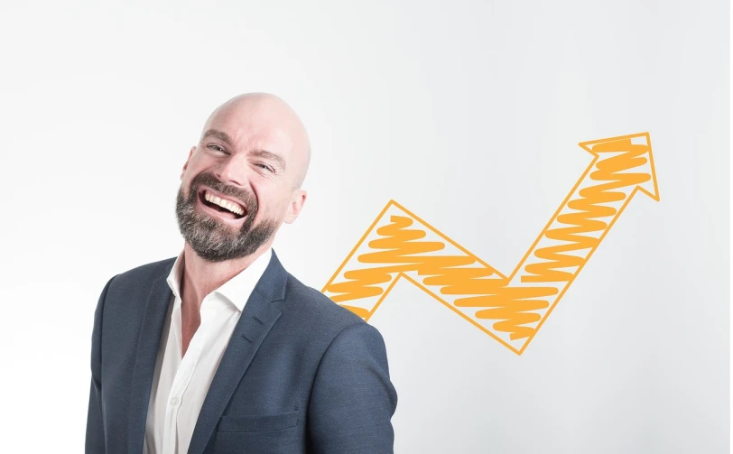 a man in a suit laughing with an arrow drawn on the wall behind him, trending on pixabay, figuration libre, bald with short beard, three day growth, high key, benjamin vnuk