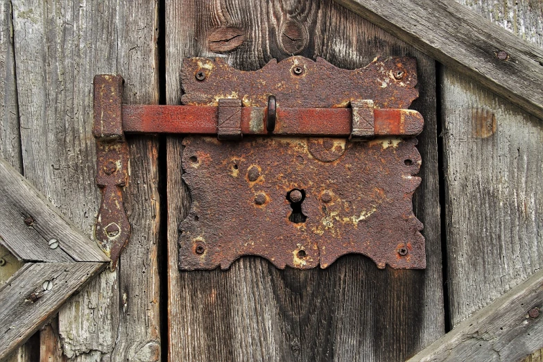 a close up of a lock on a wooden door, by Jan Stanisławski, renaissance, rust, keygen, cottage close up, gate to hell