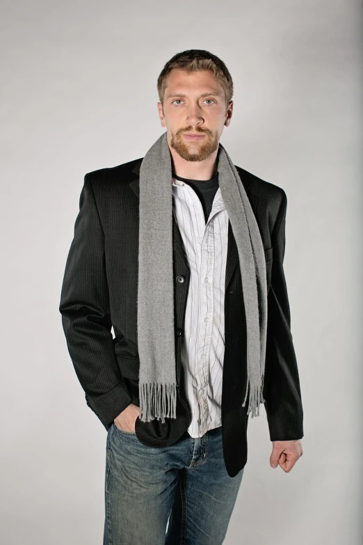 a man in a suit and scarf posing for a picture, inspired by Alexander Scott, flickr, commercial product photography, grey clothes, -h 1024, wearing casual clothing
