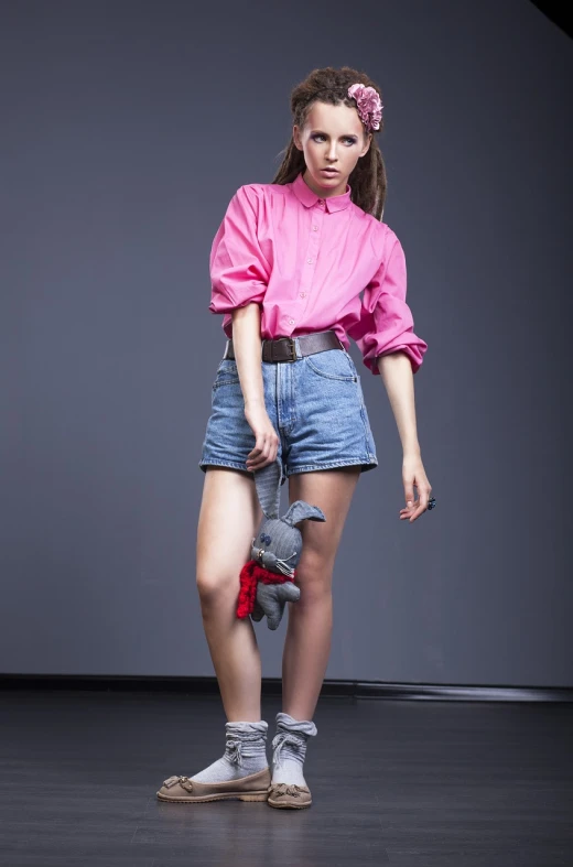 a woman in a pink shirt is holding a teddy bear, inspired by Josef Abel, trending on cg society, denim hot-pants, collar and leash, avant garde fashion model, in style of thawan duchanee