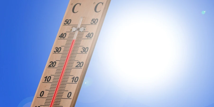 a close up of a thermometer with the sun in the background, a photo, by Julian Allen, shutterstock, bauhaus, with a blue background, full - length photo, stock photo, heat shimmering