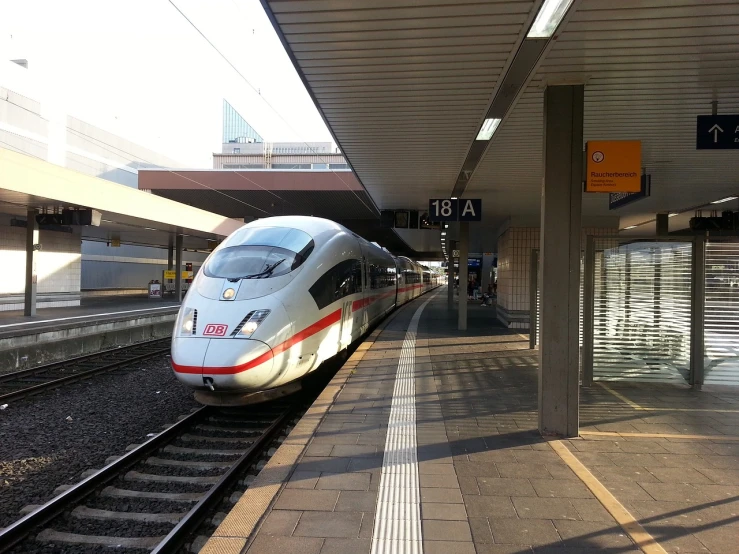 a train pulling into a train station next to a platform, a picture, by Jakob Gauermann, flickr, bullet train, iphone photo, [32k hd]^10, nuremberg