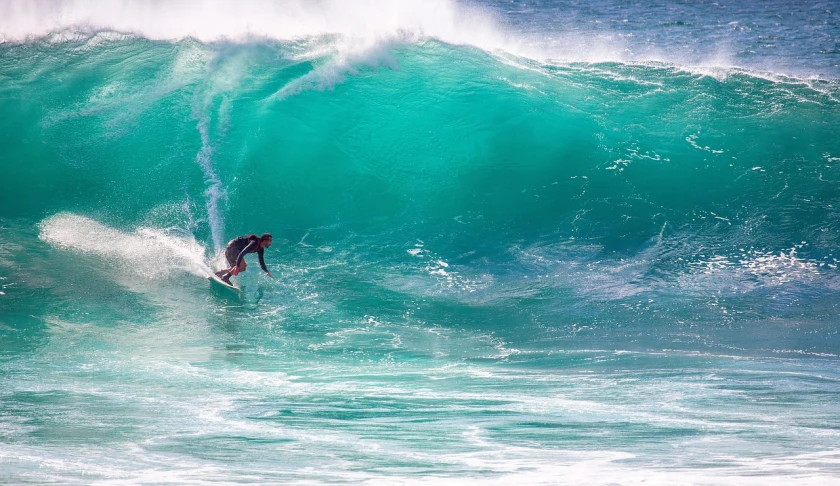 a man riding a wave on top of a surfboard, pexels, sydney, water pipe, regular sized, extreme panoramic