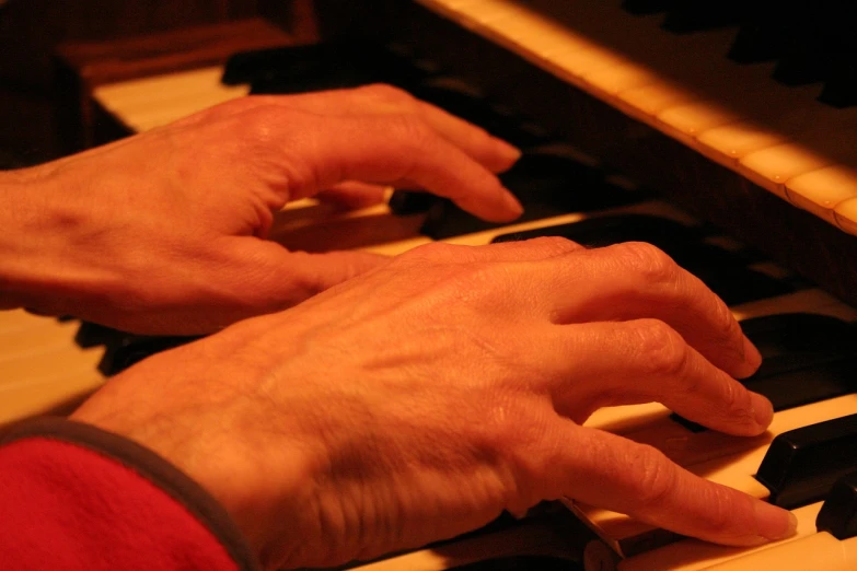 a close up of a person playing a piano, precisionism, wikimedia commons, gnarled fingers, swollen muscles, boston