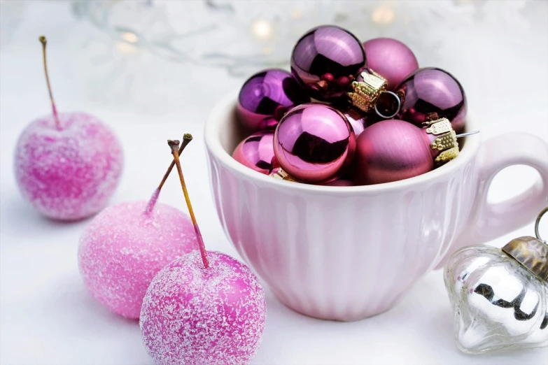 a white bowl filled with pink and silver ornaments, a still life, by Zofia Stryjenska, pexels, plum color scheme, wallpaper - 1 0 2 4, frosted, candy apple