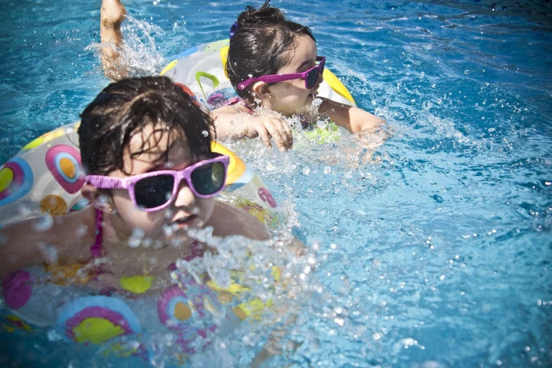 a couple of kids swimming in a pool, pixabay, implanted sunglasses, 3 4 5 3 1, laura watson, sfw