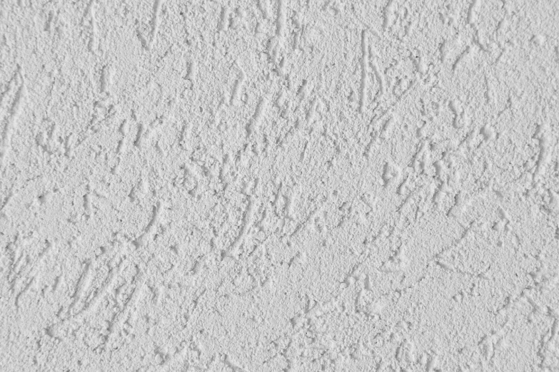 a close up of a white stucco wall, an ambient occlusion render, inspired by Grillo Demo, fine art, small finely stippled light, detailed product photo, ( ( extreme detail ) ), cascadian