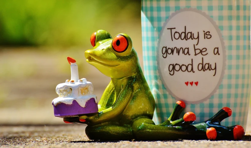 a figurine of a frog holding a birthday cake, by Robert Brackman, pixabay, happening, good at cards, background image, goodnight, 2 0 0 0's photo