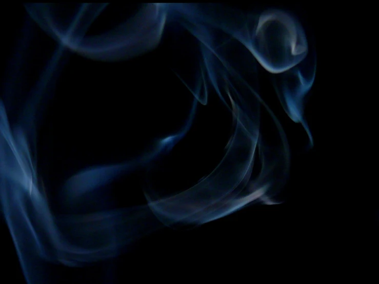 a close up of smoke on a black background, inspired by Rodney Joseph Burn, flickr, lyrical abstraction, blue soft light, shot on a 2 0 0 3 camera, shot on 1 6 mm, smoke around her