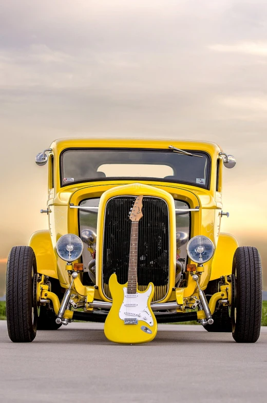 a yellow car with a guitar in front of it, a portrait, inspired by Ed Roth, pexels contest winner, vertical wallpaper, ford model t, hq 4k phone wallpaper, full view of a car