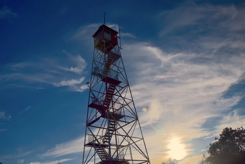 a tall tower with a clock on top of it, by Adam Chmielowski, flickr, last light on mountain top, alabama, sk, firewatch