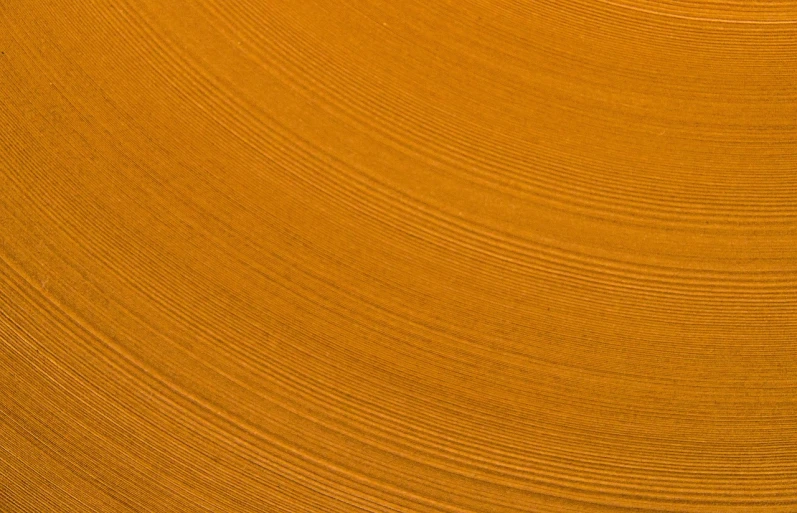 a man riding a surfboard on top of a sandy beach, inspired by Andreas Gursky, flickr, lyrical abstraction, ocher details, close-up product photo, lacquer on canvas, high angle close up shot