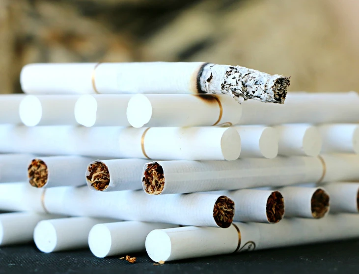 a stack of cigarettes sitting on top of a table, by Magdalene Bärens, pexels, hyperrealism, white horns, jackstraws, istockphoto, demolition