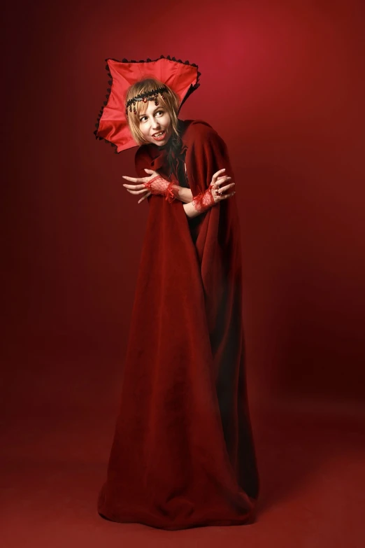 a woman in a red dress and a red umbrella, a portrait, inspired by Ray Caesar, conceptual art, scary angry pose, she is dressed in shaman clothes, on a red background, showstudio