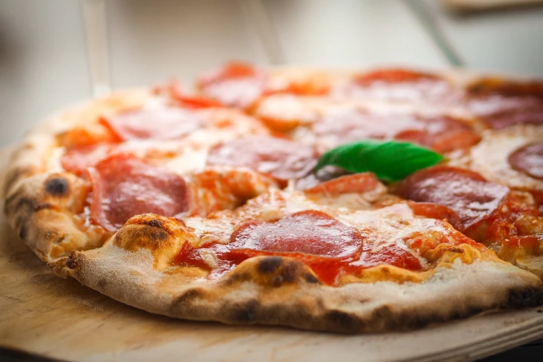 a pepperoni pizza sitting on top of a wooden cutting board, by Matteo Pérez, naples, daily specials, cooky, tastes