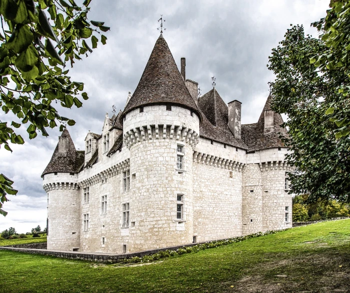 a large white castle sitting on top of a lush green field, inspired by Pierre Toutain-Dorbec, flickr, renaissance, elegant walkways between towers, gray, trulli, wide angle photography