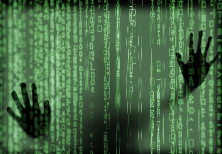 a close up of a person's hands in front of a computer screen, a digital rendering, by Julian Allen, shutterstock, ascii art, green matrix code, hooded figures, background image, attacking