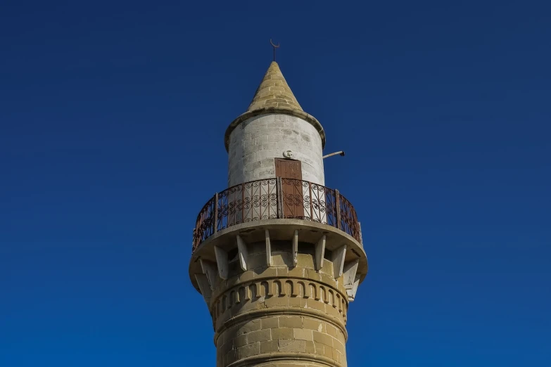a tall tower with a clock on top of it, inspired by Pedro Álvarez Castelló, art nouveau, mardin old town castle, high detail photo, lighthouse, top - side view