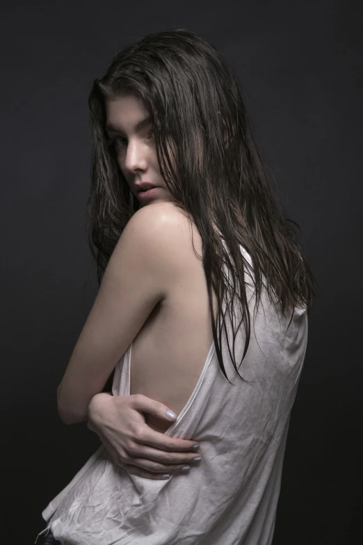 a woman with wet hair posing for a picture, by irakli nadar, tumblr, photorealism, hailee steinfeld, hands behind back, helmut lang, laetitia casta