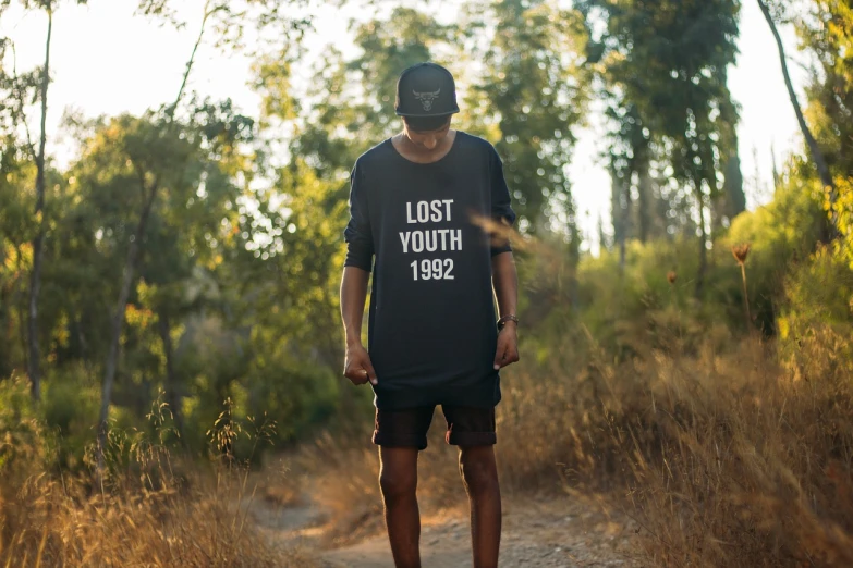 a man riding a skateboard down a dirt road, a portrait, by Lucas Vorsterman, unsplash contest winner, graffiti, vintage shirt, lost in a forest, he is about 20 years old | short, los angeles 2 0 1 5