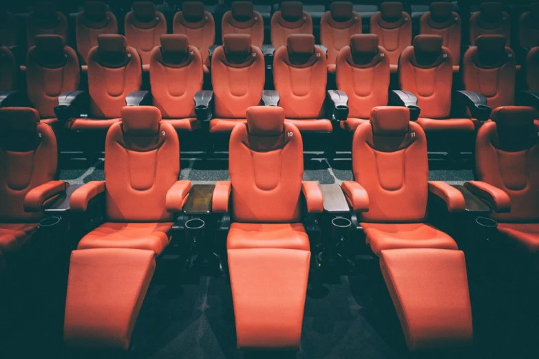 an empty theater with rows of red seats, a cartoon, shutterstock, hypermodernism, sci-fi movie cinematic frame, reclining, cinematic beeple, sitting in a plastic throne