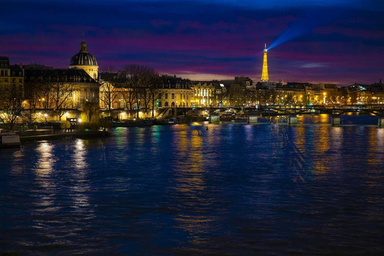a view of the eiffel tower from across the river, a photo, by Etienne Delessert, shutterstock, paris school, night colors, january, lakeside, “ golden chalice