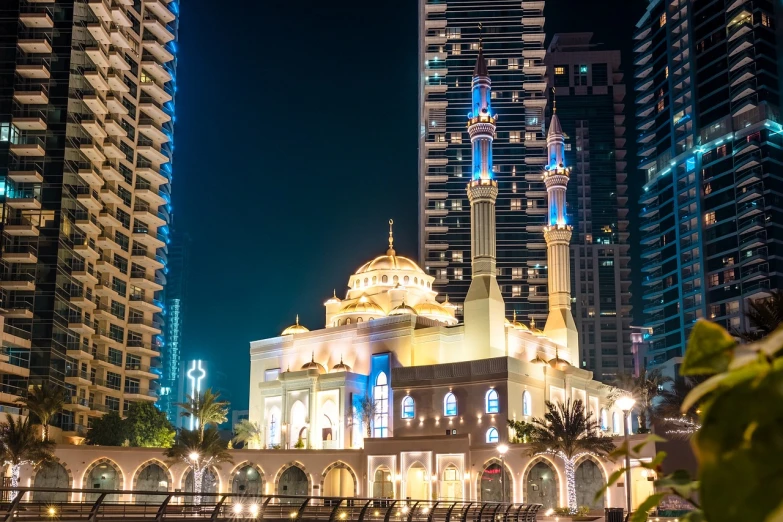 a large building in the middle of a city at night, by Bernardino Mei, shutterstock, hurufiyya, praise the omnissaiah, dubai, sunday, decorated