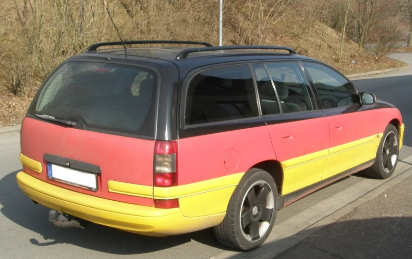a red and yellow van parked on the side of the road, by Ladrönn, hsv, top - side view, some glints and specs, taurus