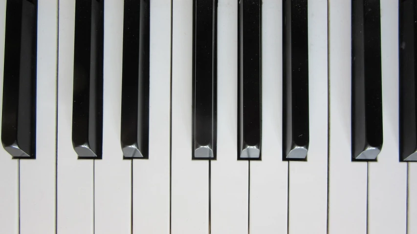 a close up of the keys of a piano, minimalism, discovered photo