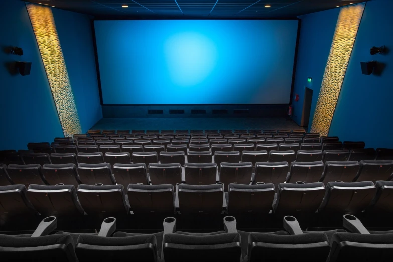 a theater with rows of empty seats and a projector screen, a picture, by Robert Jacobsen, shutterstock, cinematic ， - h 7 6 8, cinematic blue lighting, underground box office hit, the