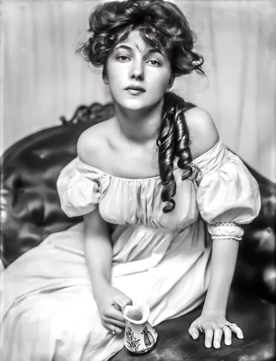 a black and white photo of a woman sitting on a couch, a colorized photo, inspired by Howard Chandler Christy, trending on pixabay, art nouveau, rossetti bouguereau, liberty curls, mary elizabeth winstead, princess portrait